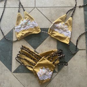 Fede gold and white lace with leopard print bikini. Large top medium bottom.